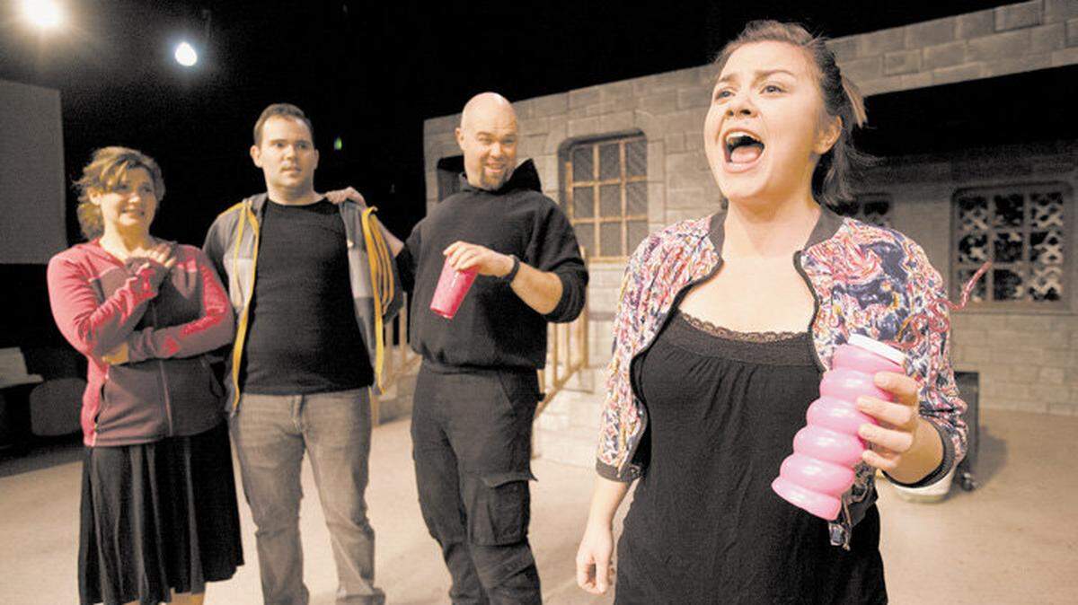 From left, actors Alicia Klein,  Gregory Gorrindo, Nathan Emmons and Katie Gucik rehearse a sketch titled "Sidelines," about parents at a soccer game. The sketch appears in  "We're Canceling Cable! (and other empty threats)" by Michael Kaplan, playing at San Luis Obispo Little Theatre. 

Photo by Laura Dickinson 1-12-15