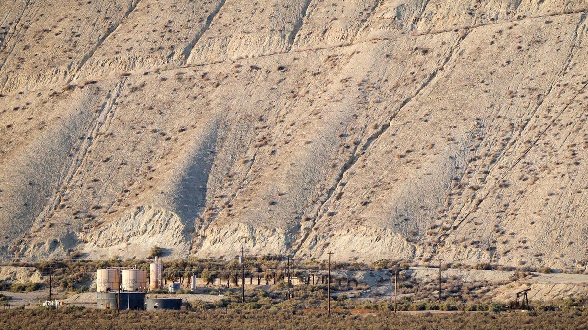 An oil well pad and storage facility at the base of the Caliente Range north of the Cuyama River June 22, 2022.