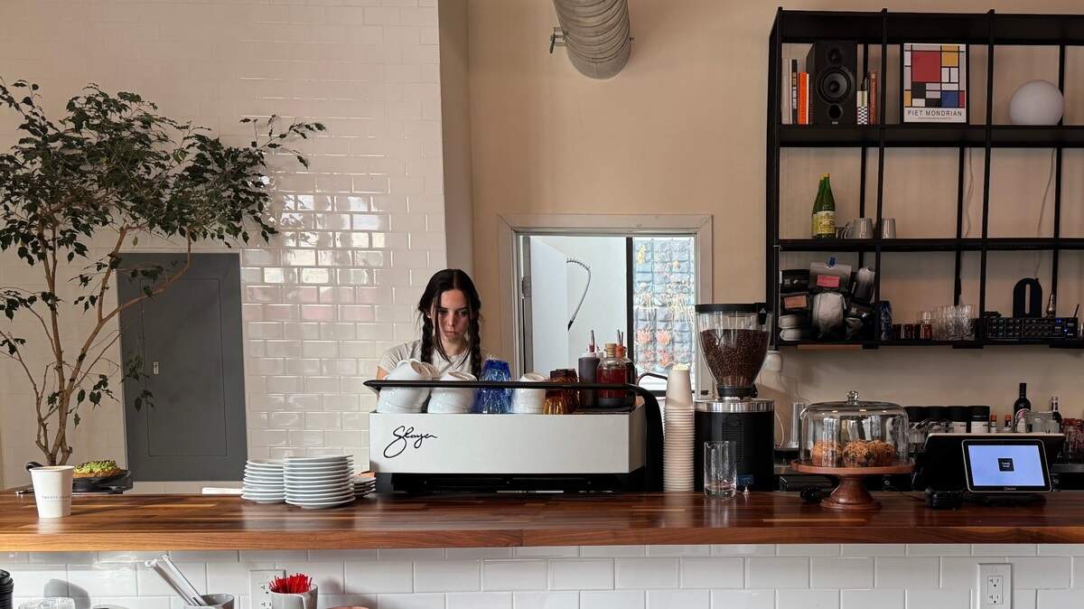 Barista Haley Duffy, pours a mocha at Twenty South, a new cafe in the San Luis Obispo Public Market.
