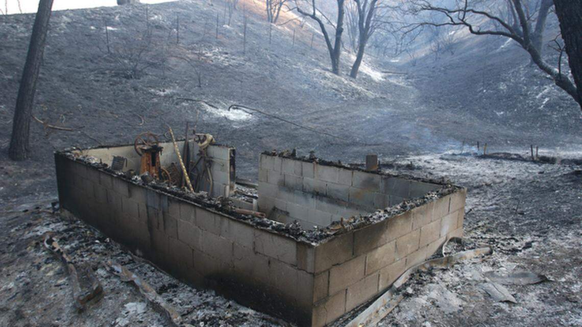 A destroyed out building on Las Pilitas Road on Sunday morning.