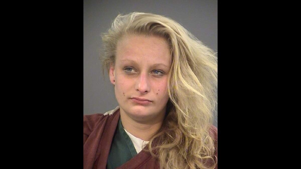 Melissa Peck, 21, was arrested Sunday after police said she stabbed another woman in the chest after they fought about their “romantic involvement” with the same man.