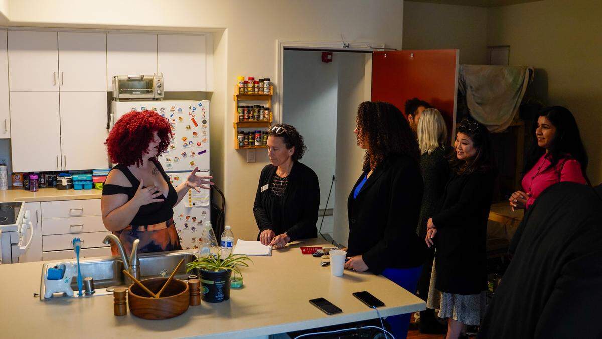 Cheyenne Sobers, left, a resident of the Broad Street Place affordable housing development by People’s Self-Help Housing, speaks with San Luis Obispo City Council member Michelle Shoresman (center) and Mayor Erica Stewart (right).