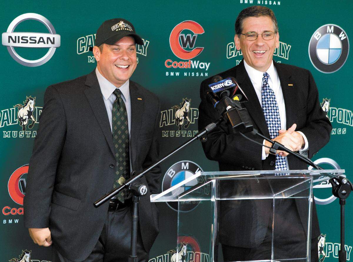 Cal Poly President Jeffrey D. Armstrong, right, introduces Don Oberhelman as the Mustangs’ new athletic director in March 2011.