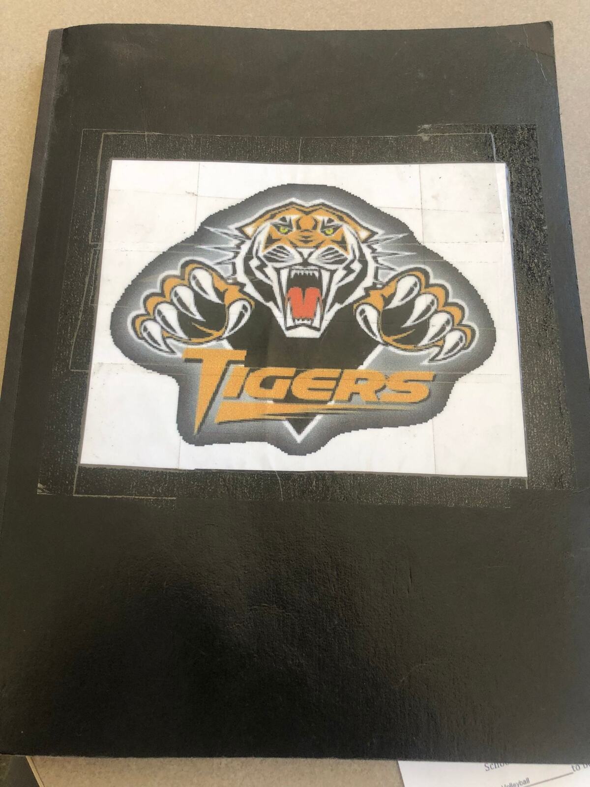 The cover of the SLO Tiger Football record book