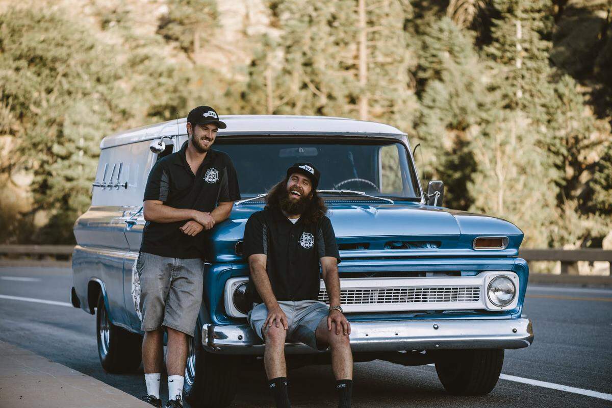 Longtime friends Taylor Steers, left, and Corbin O’Reilly, right, co-own Tap Truck USA, which serves draft beer out of vintage vehicles and has licensed its business to operators around the country.