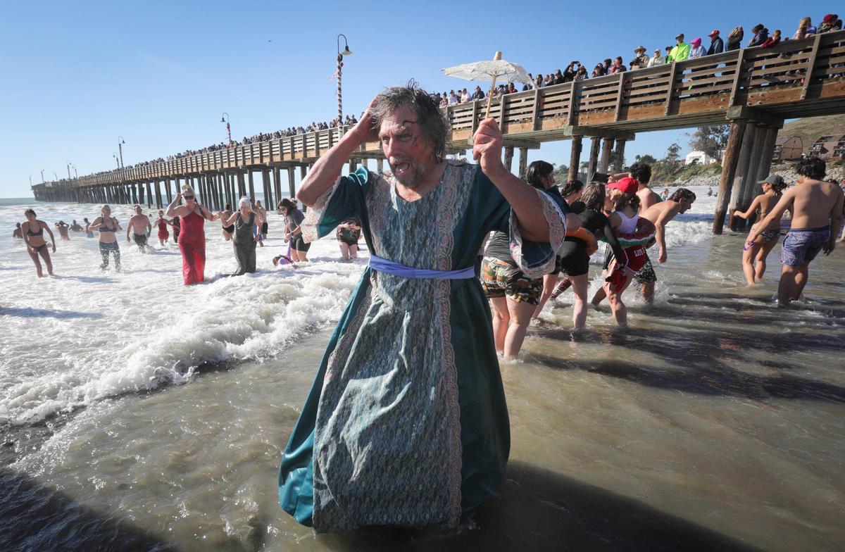 Bob Davis of Los Osos had a “Gone With the Wind” moment when the others in his group were separated after the noon plunge into the Pacific Ocean. About 1,000 people celebrated the New Year plunging into the surf at Cayucos at the 44th annual Carlin Soulé Memorial Polar Bear Dip on Jan. 1, 2024.