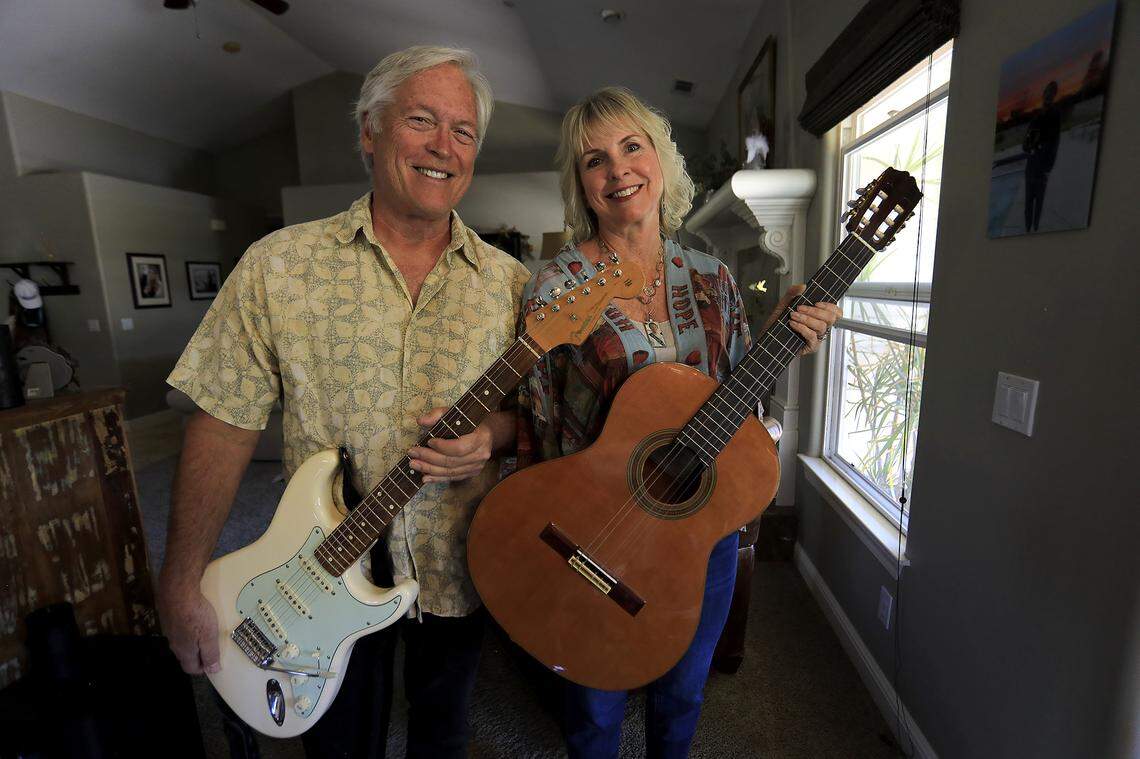 Jim and Lauri Strain pose in their Templeton home with their son Ian Strain’s favorite guitars. Ian died by suicide after being diagnosed with cannabis-induced psychosis and bipolar 1.