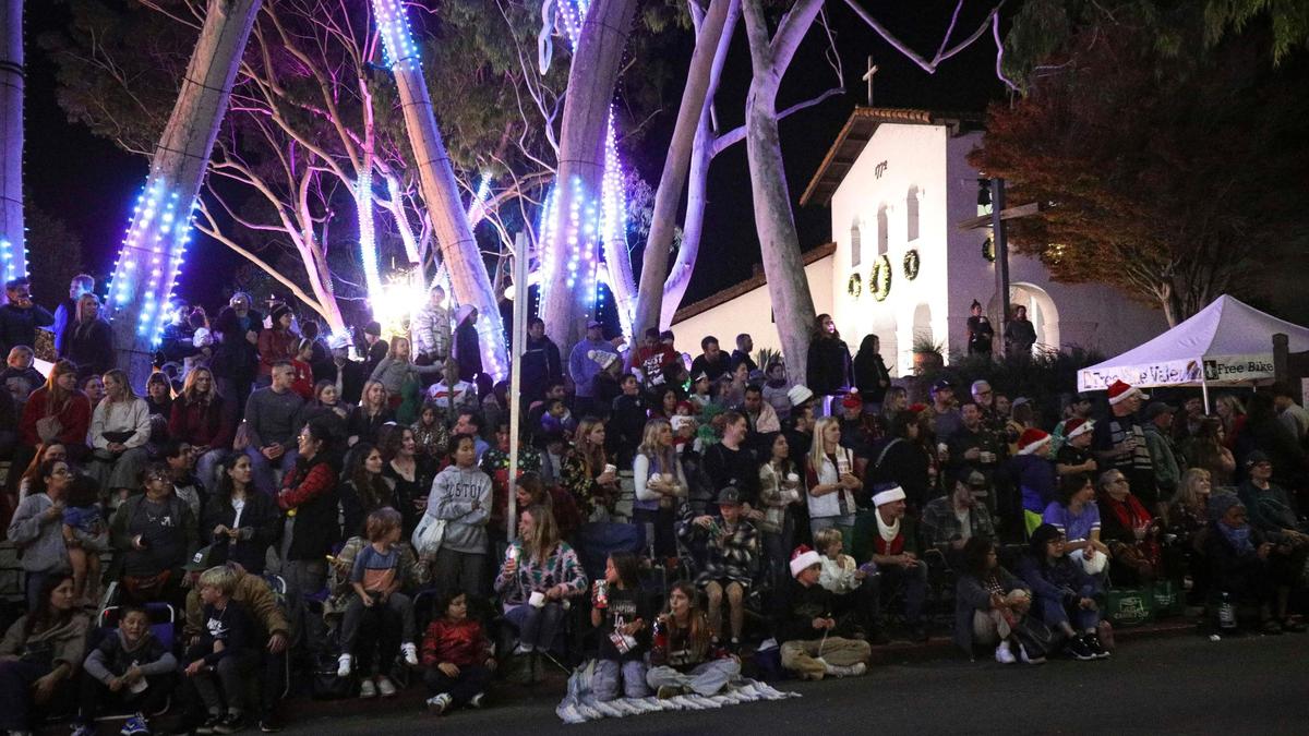Unseasonably warm weather encouraged a large crowd up to six rows deep at the Missionas they watched the 48th annual downtown Holiday Parade. on Dec. 6, 2024.