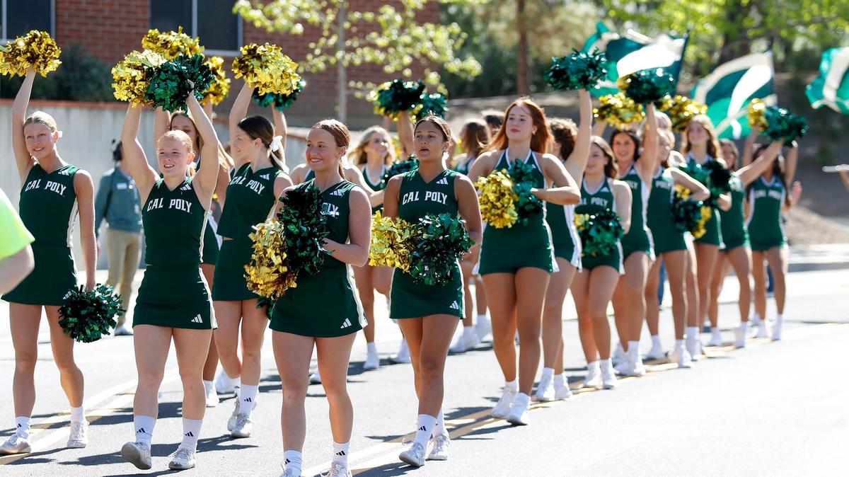 Cal Poly cheerleaders march in the parade as Cal Poly hosted its annual Open House for admitted and prospective students on April 12, 2025. Weekend events included a preview of SLO Farmers Market, a parade and the Poly Royal Rodeo.