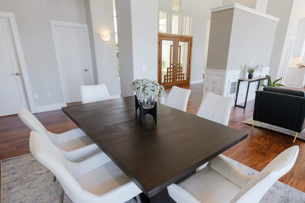 The dining room table seats 12 with extensions in Jovita and Alex Honor’s Arroyo Grande house.