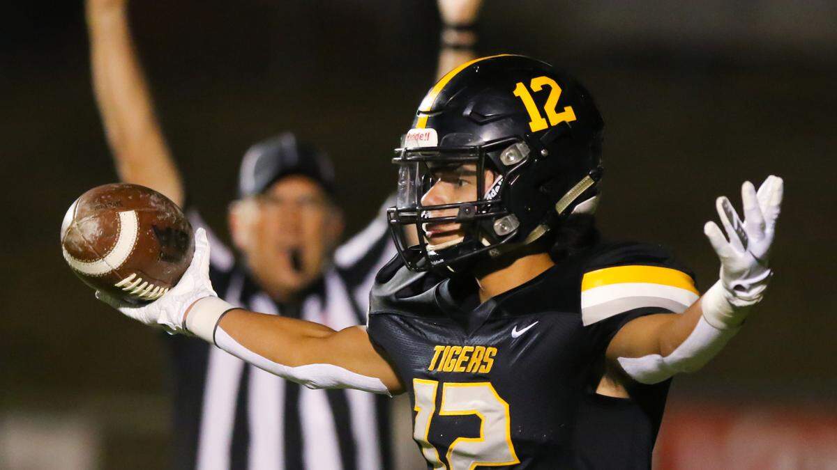 Max Soltero celebrates a touchdown catch. San Luis Obispo High School hosted Madera in a football playoff. David Middlecamp 11-15-2019