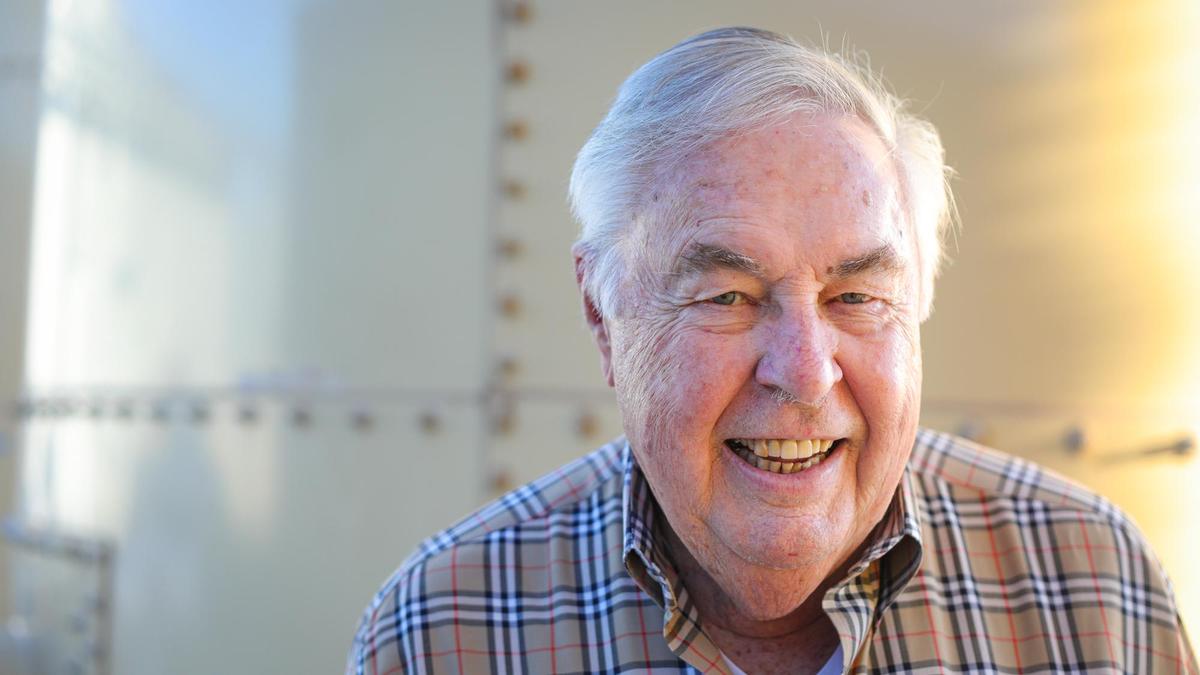 Jerry Lohr, founder of J. Lohr Vineyards & Wines, stands in front of a tank used to recycle winery water for irrigation on Nov. 12, 2021. The company has invested in water-efficient processes.