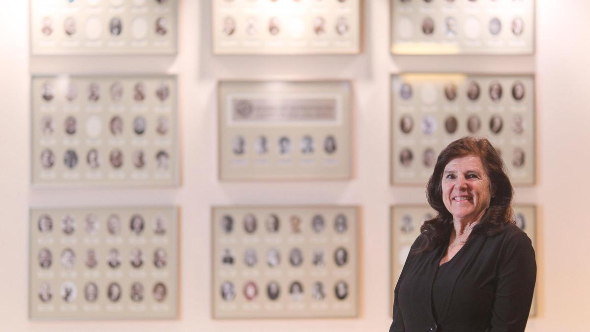 Debbie Arnold began serving as San Luis Obispo County’s 5th District Supervisor in 2013. Behind her are portraits of current and previous supervisors. She is retiring after three terms, seen here on Dec. 16, 2024.