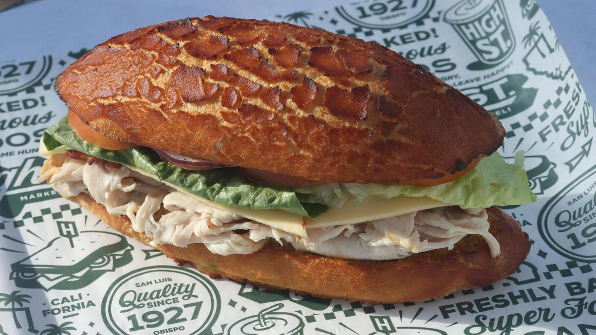 High Street Deli’s Dutch Punch sandwich features smoked turkey, bacon, jalapeño havarti, red onion, tomato, romaine, avocado and chipotle mayo on a Dutch crunch roll. 