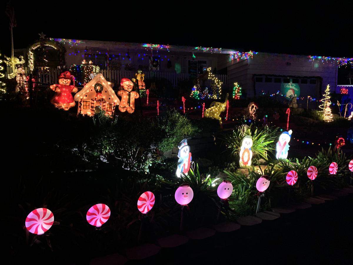 One of the best spots to see lights in Atascadero is along Marchant Way on the west side of Atascadero Lake, including this home with its candy theme.