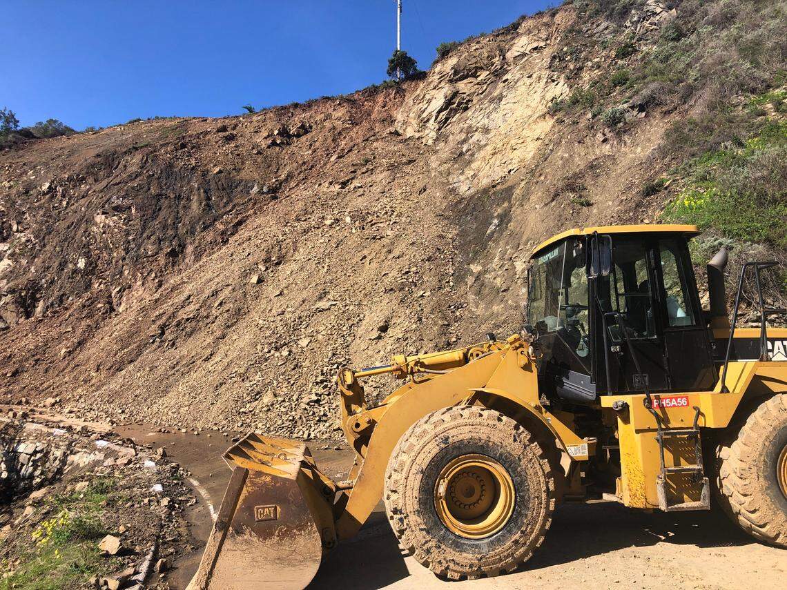This is one of many large pieces of construction equipment being used to clear about 40 miles of Highway 1 of landslides and debris that hit the pavement in December and January, 2023. The road segment between the Piedras Blancas elephant seal rookery at the south and Lime Creek at the north is closed to the public., cutting off access for residents, visitors, suppliers and others. The cleanup, road repair and bluff stabilization process will be lengthy, according to Caltrans.