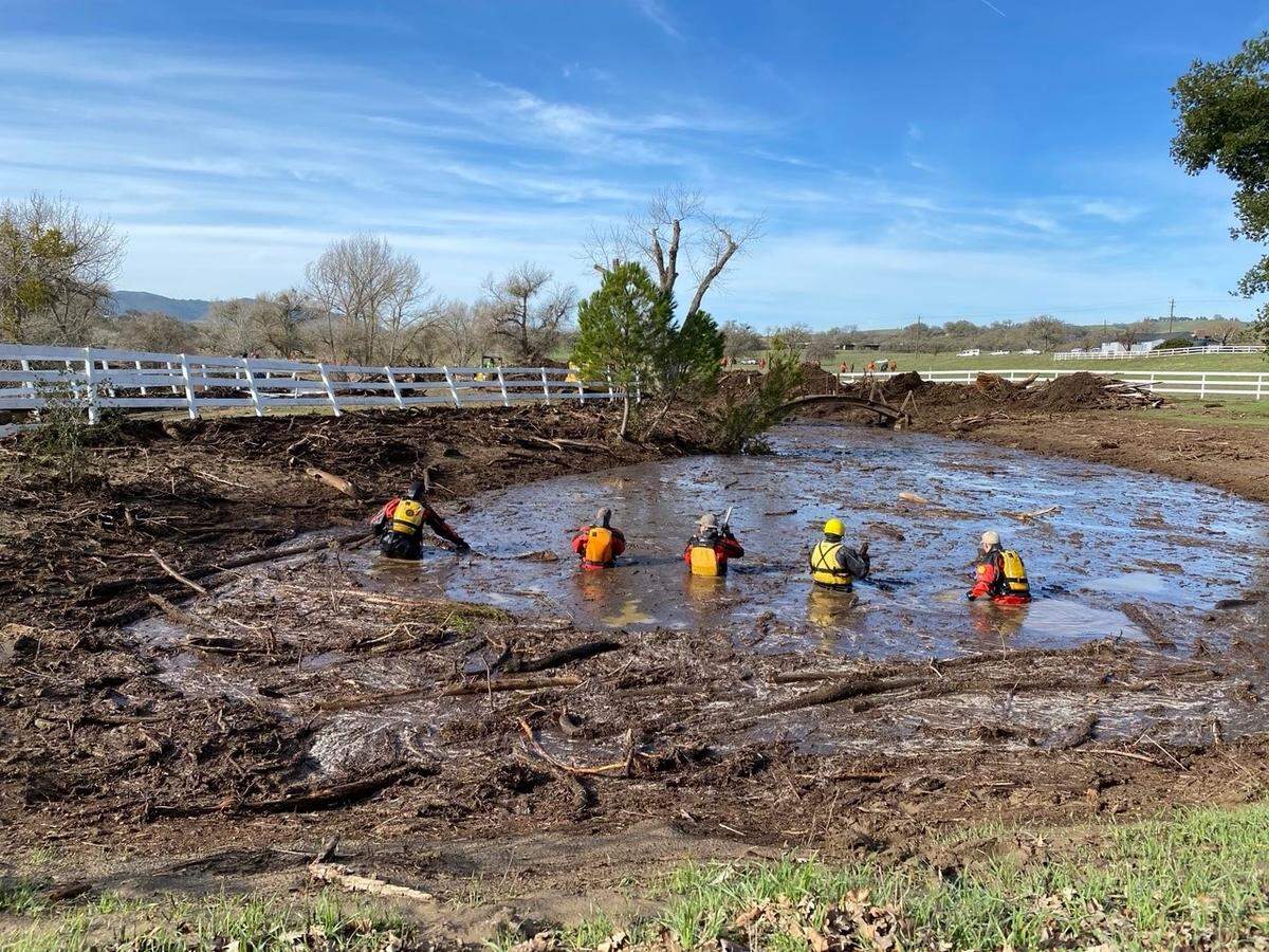 Search teams look for 5-year-old Kyle Doan, who went missing Jan. 9, 2023, near San Miguel when he was carried away by floodwaters. Doan has not been found after three days of searching.