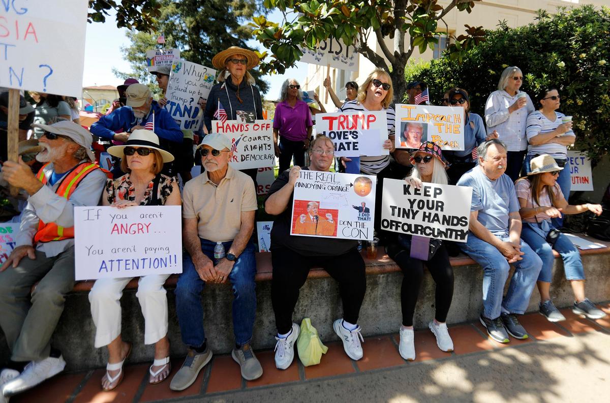 Thousands of people gather at San Luis Obispo Superior Court in California as part of the “Hands Off!” rally to protest President Donald Trump and his advisor Elon Musk.
