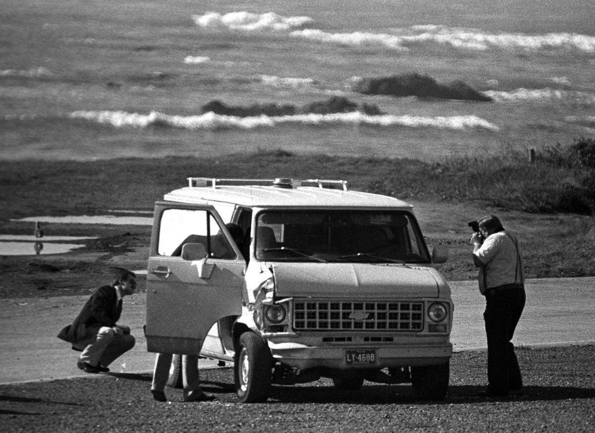 Investigators study a van in which a woman’s body was found near San Simeon. Dorothy Alace “Toby” Tate was found shot to death in her van 2.5 miles north of Hearst Castle in 1983.