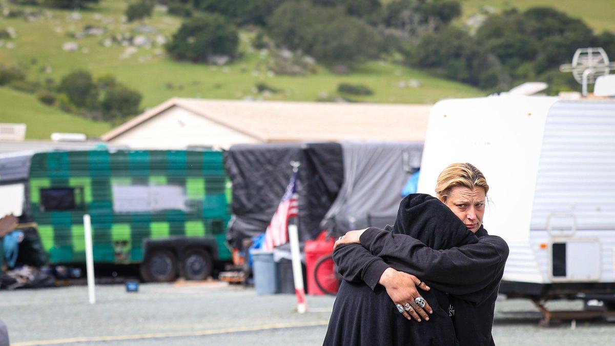 Ashley Noel Curtiss, left, gets a hug from mom Sarah Angel. They are residents of the safe parking site at Oklahoma Avenue in San Luis Obispo.