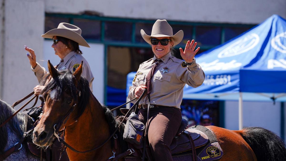 Mounted San Luis Obispo County Sheriff’s Office deputies wave to watchers at the Templeton Fourth of July Parade Thursday, July 4, 2024. The parade featured dozens of floats and acts, including classic cars, marching bands and appearances by local law enforcement and fire services.