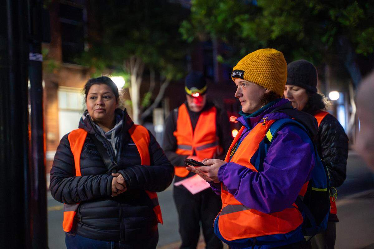 Point-In-Time Count volunteer Jenn Fields conducts a survey with homeless individual near the San Luis Obispo County Courthouse on Tuesday, Jan. 27, 2026. The PIT Count is held every other year, and relies on networks of volunteers who count and survey as many homeless individuals as possible.