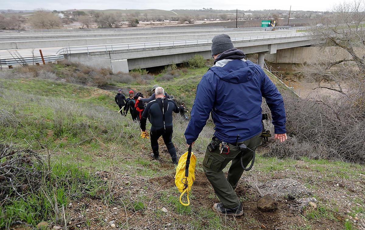 Members of the San Luis Obispo County Sheriff’s Office’s Search and Rescue Dive Team are among those looking for any sign of 5-year-old Kyle Doan on Wednesday, Jan. 11, 2023, two days after he disappeared in swollen San Marcos Creek near San Miguel.