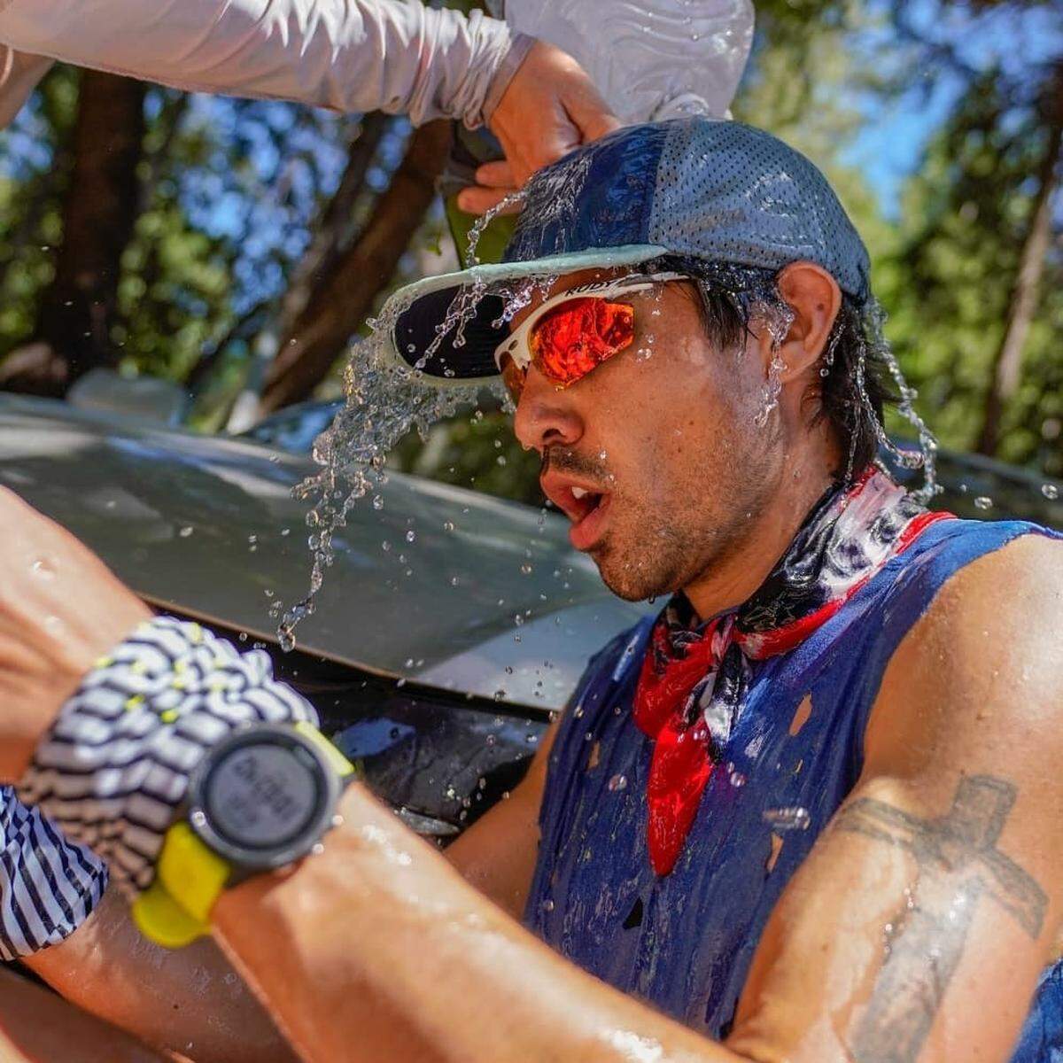 Mario Mendoza is cooled off with water at the Forest Hill aid station (mile 62) during the “Western States 100” endurance race that ran from Squaw Valley, California, to Auburn, Oregon, on June 24, 2018. He finished 16th out of 299 runners.