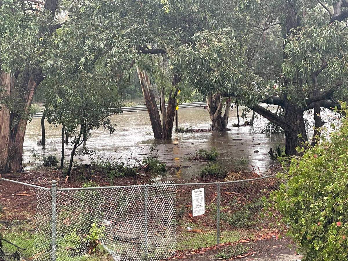 Highway 101 was under more than a foot of water under the Santa Rosa Street overpass in San Luis Obispo after a backed up drain flooded the road.