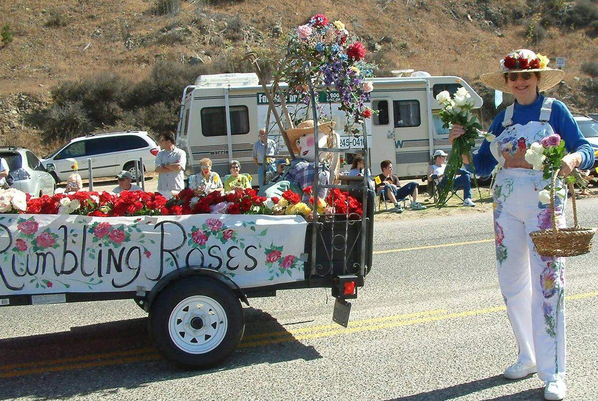 A member of Cambria’s The Garden Club, accompanies the club’s 2005 float in the Pinedorado parade.