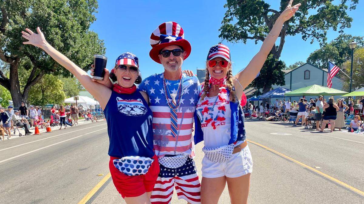 Decked out in red, white and blue, Sarah Tomasetti, Katie Hayword and Tyson Hayword celebrate the Fourth of July at a Templeton parade sponsored by the community’s Rotary Club.