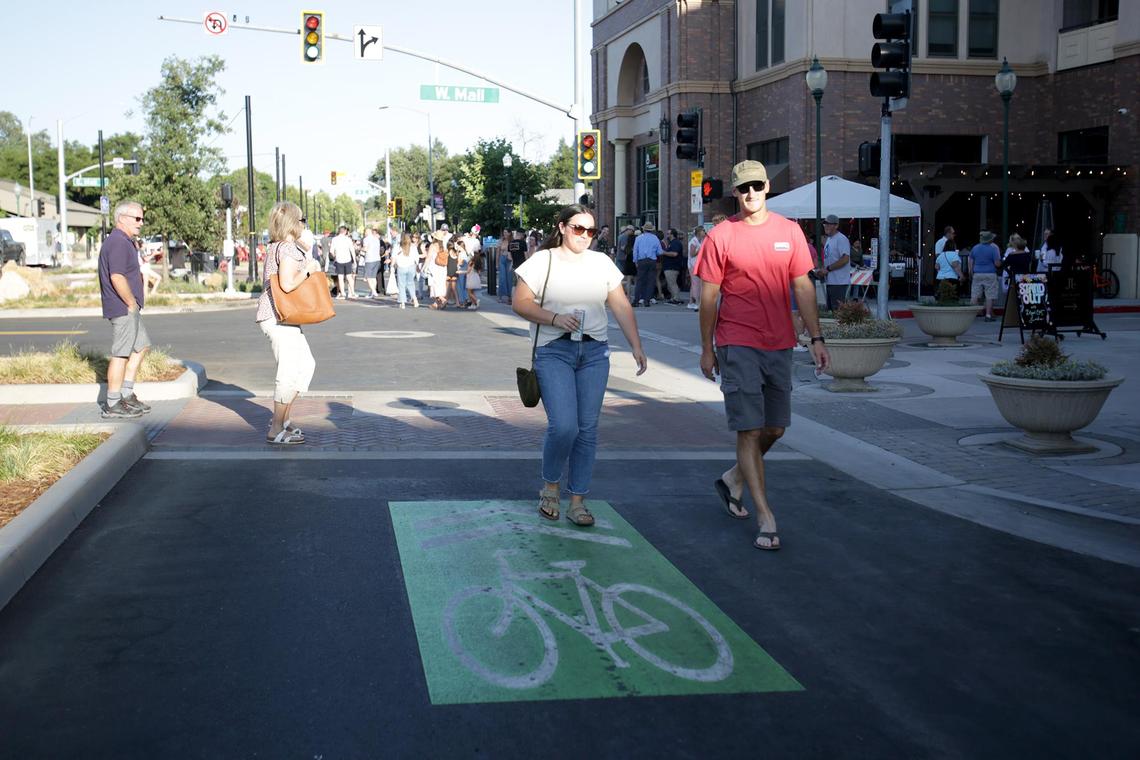 People enjoy with block party after a ribbon-cutting ceremony held Friday, June 27, 2025. Atascadero, California, completed its downtown makeover on El Camino Real with new parking, lights and greenery.