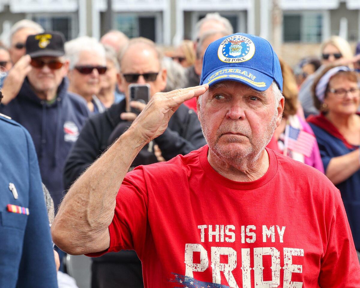 Air Force veteran Mark Rogers salutes the flag. He served 22 years including Viet Nam. A standing room crowd attended as Pismo Beach held their Memorial Day ceremony at the Pier before noon.