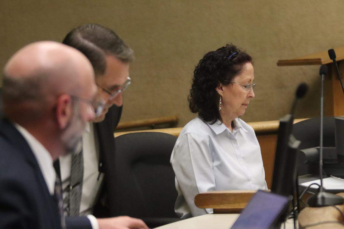 Deputy District Attorney Ben Blumenthal, left, District Attorney Investigator Fred Phlum and Gaea Powell, seen here in court during Powell’s preliminary hearing on April 1, 2026. Powell is charged with nine counts of election fraud.