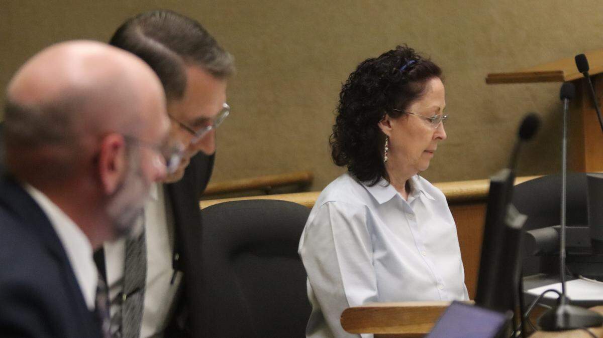 Deputy District Attorney Ben Blumenthal, left, District Attorney Investigator Fred Phlum and Gaea Powell, seen here in court during Powell’s preliminary hearing on April 1, 2026. Powell is charged with nine counts of election fraud.