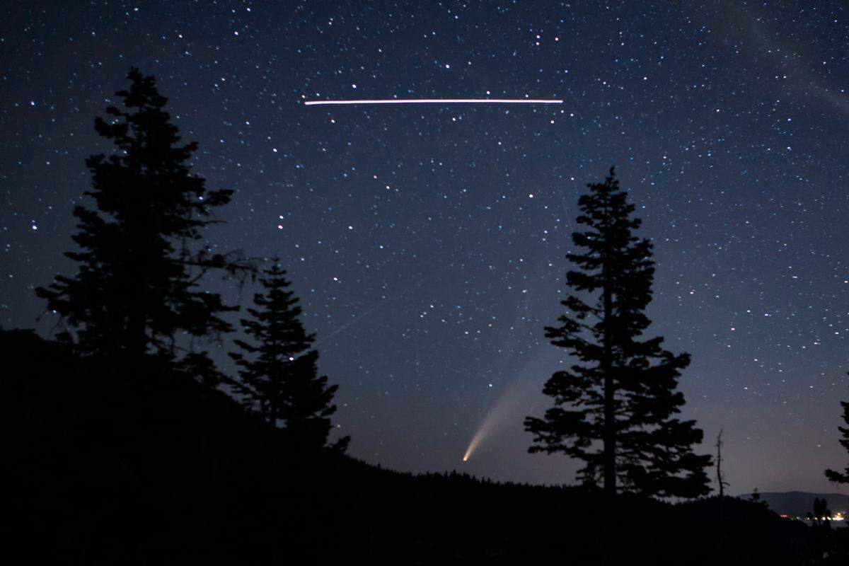 San Luis Obispo County photographer Dave Fleishman shot this photo of the NEOWISE comet with the International Space Station flying overhead in the skies above Lake Tahoe.