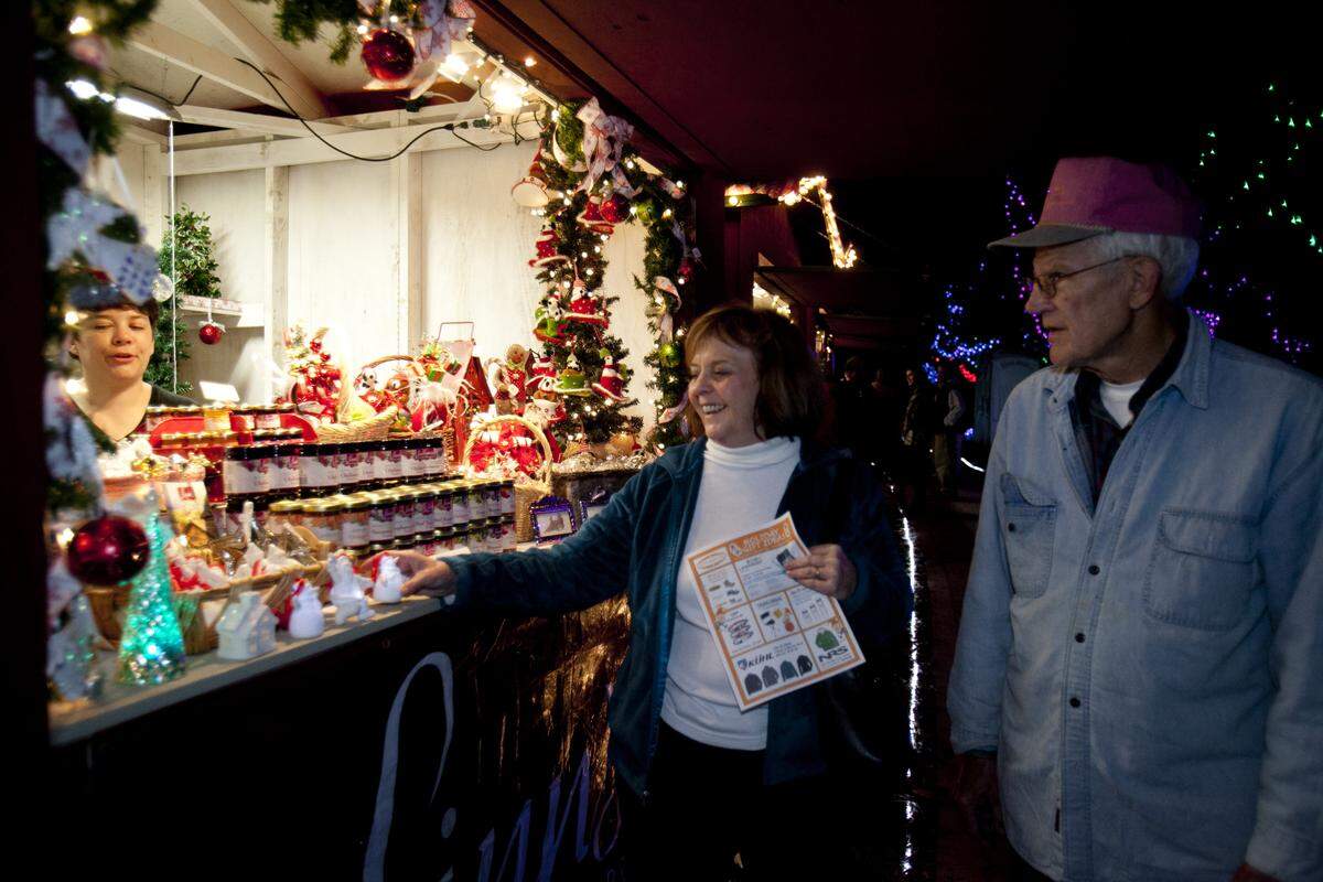 Mary and Mitt Wokenn peruse the Linn’s Restaurant booth at the Cambria Christmas Market in 2012.