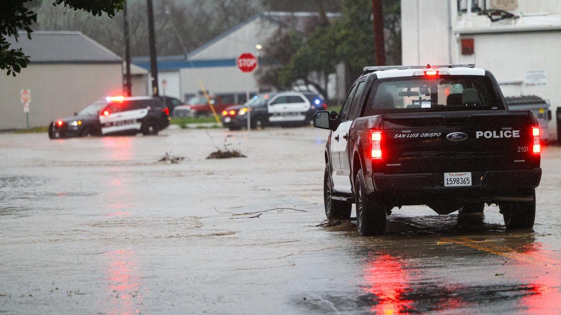 San Luis Obispo police blocked South Higuera street near Marsh Street as San Luis Creek overflowed if its banks. Flooding in SLO county was widespread Jan. 9, 2023, as another “atmospheric river” storm hit the coast.