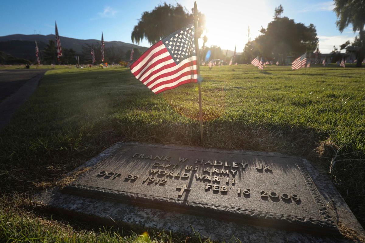 World War II veteran Frank Hadley Jr.’s grave was marked with a flag on Friday, Nov. 10, 2023, as volunteers set flags out at Los Osos Valley Mortuary and Memorial Park in honor of Veterans Day.