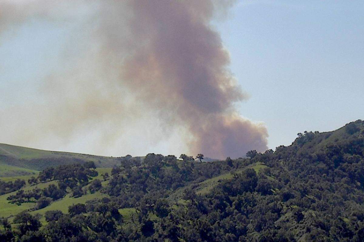 Smoke rises from a vegetation fire burning Saturday afternoon, March 12, 2022, on Hollister Ranch near Gaviota.