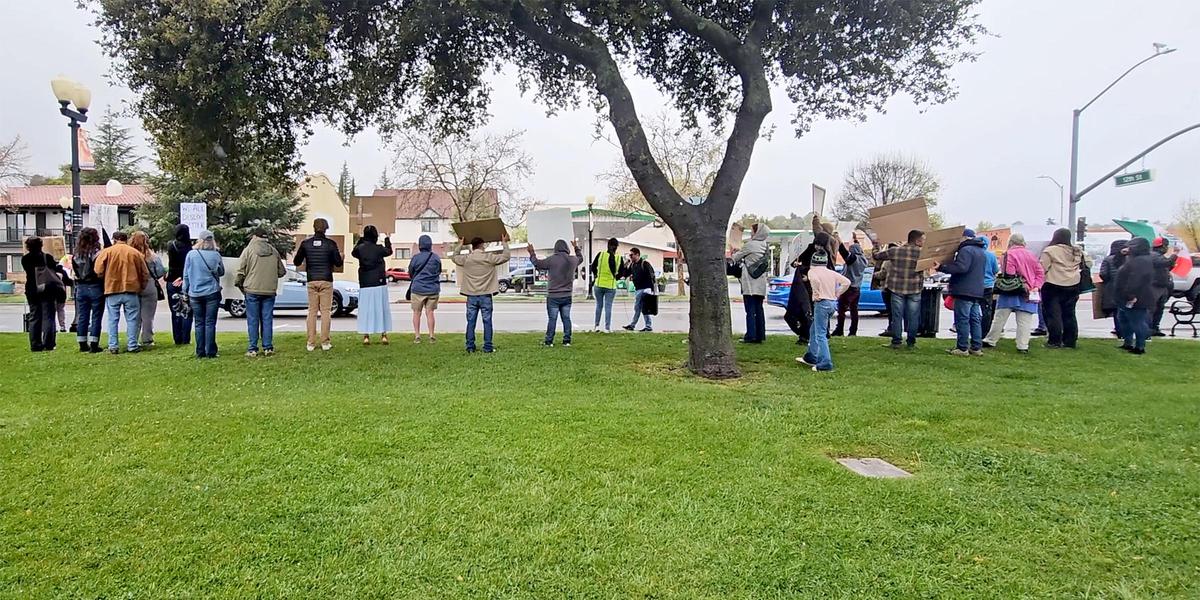 Cars honked on Spring Street as the protesters stood on the sidewalk. The Mixteco Indígena Community Organizing Project and other immigrant advocacy organizations led a march in Paso Robles to protest deportation and President Donald Trump’s immigration policies on Sunday, March 30, 2025.