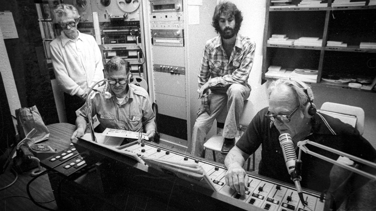KCBX-FM studios, Bearded Charlie Savoca trains “Big Band Show” members Bob Connolly, Al Davis and Jack Graham. This image is from Oct. 8, 1980.