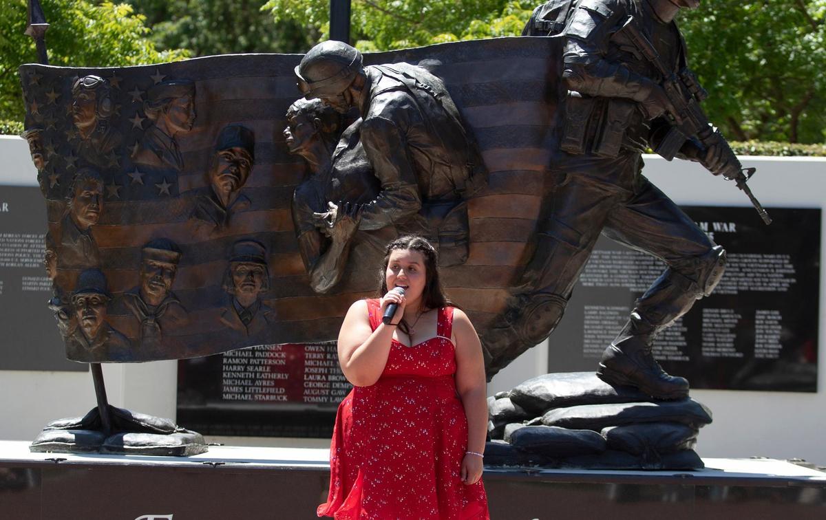 Mya Nelson, a member of the Atascadero High School choir, sang a solo in front of the memorial during Atascadero’s annual Memorial Day celebration on May 27, 2024.