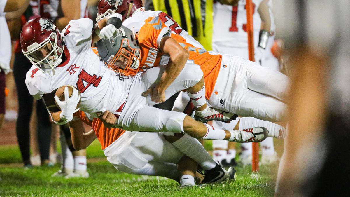 Hayden McKanna is brought down by Mason Degnan. In the annual rivalry game, Paso Robles beat Atascadero 35-21 on Sept. 2, 2022.