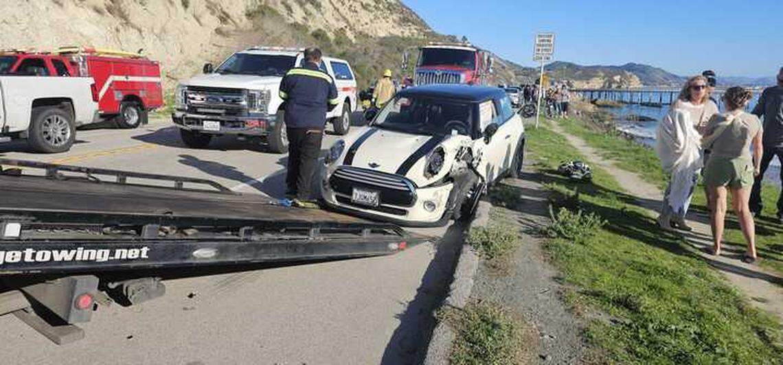 A car collided with another vehicle before crashing off of Avila Beach Drive onto Olde Port Beach below Wednesday, Jan. 1, 2025.
