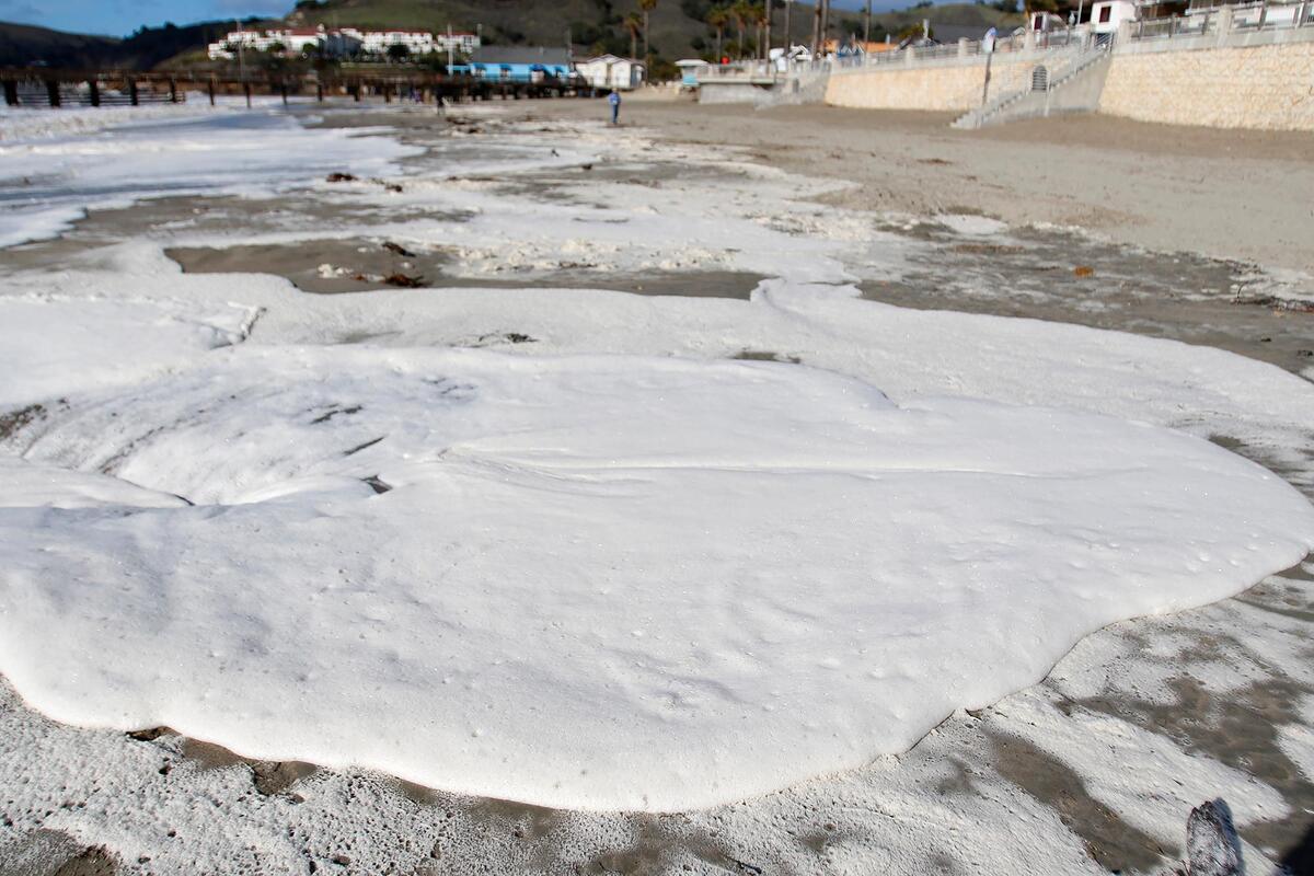 A rain storm brought large, foamy waves to Avila Beach on Sunday, Dec. 11, 2022.