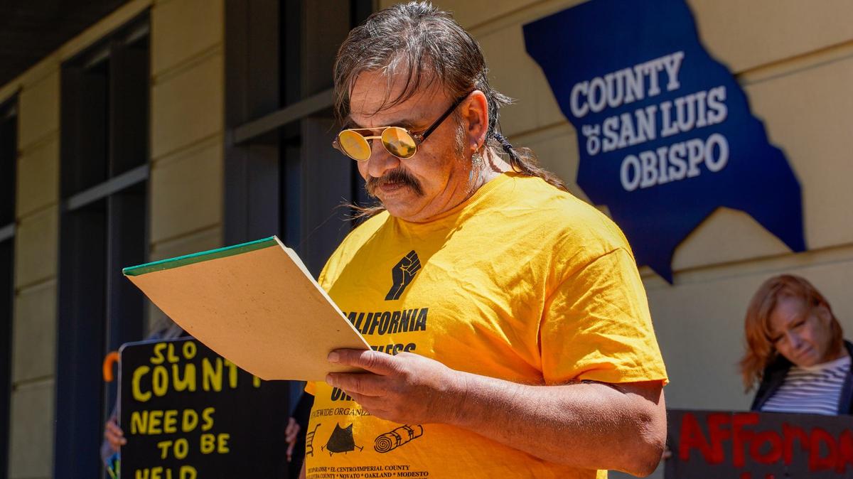 San Luis Obispo County Homless Union organizer Mike Maez speaks at an April 29, 2024 press conference at the Katcho Achadijan Government Center. The California Homeless Union reached an agreement with San Luis Obispo County to keep the Oklahoma Avenue Safe Parking site open until May 6.