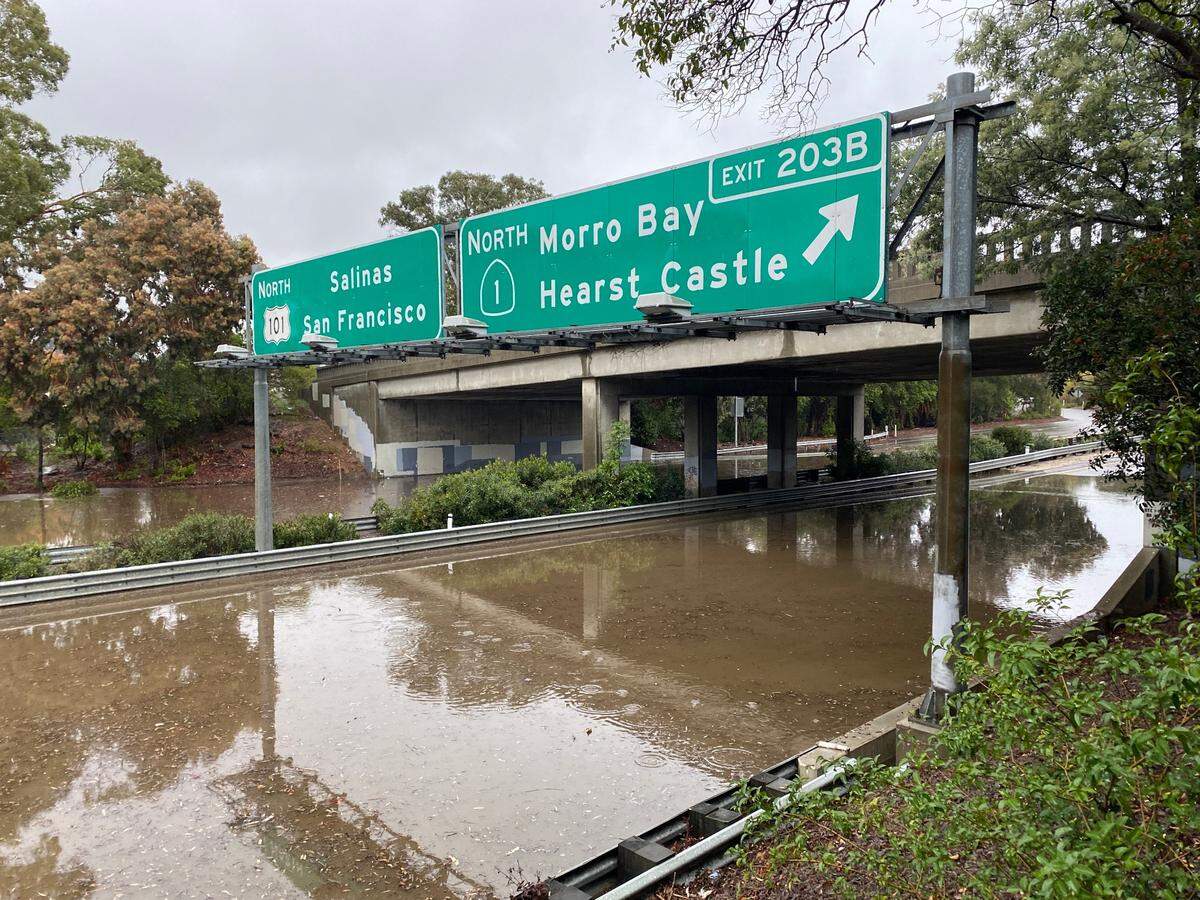 Highway 101 is flooded underneath the Santa Rosa Street overpass.