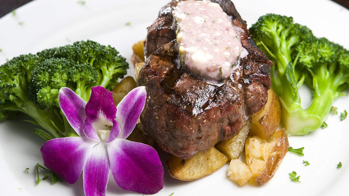 The filet with gorgonzola bistro butter served with potatoes and broccoli at Rooster Creek Tavern in Arroyo Grande.