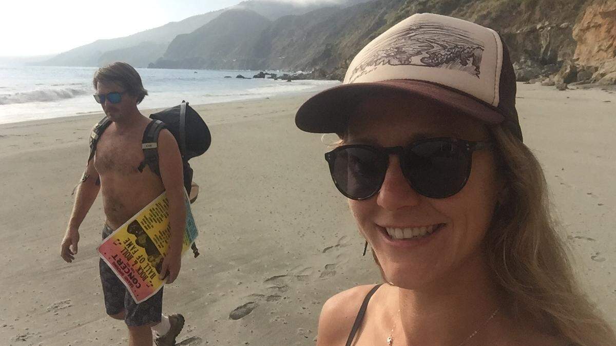 Chelsea Moore took this selfie of her and husband Chad Moore after they found the wreckage of Angela Hernandez's Jeep and just before they found Hernandez. Chad is carrying a poster they found in the vehicle.